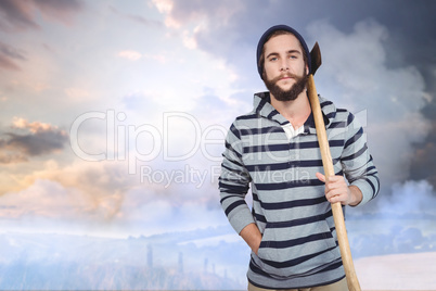 Composite image of portrait of hipster with hooded shirt holding