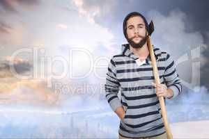 Composite image of portrait of hipster with hooded shirt holding