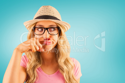 Composite image of a beautiful hipster having a fake mustache