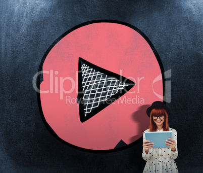 Composite image of smiling hipster woman using her tablet