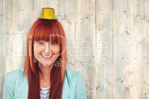 Composite image of smiling hipster woman wearing hat party