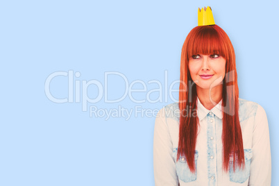 Composite image of happy hipster woman with a crowned