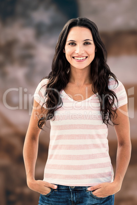 Composite image of brunette smiling to the camera