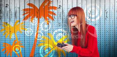 Composite image of smiling hipster woman playing video games