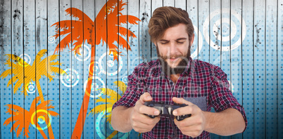 Composite image of hipster playing video game