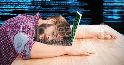 Composite image of hipster napping with head on laptop