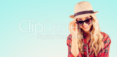 Composite image of gorgeous smiling blonde hipster posing with s