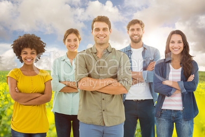 Composite image of group portrait of happy young colleagues