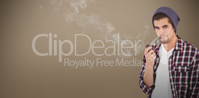 Composite image of portrait of  confident hipster holding smokin