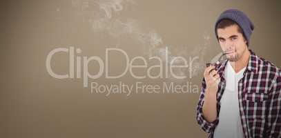 Composite image of portrait of  confident hipster holding smokin