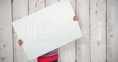 Composite image of hipster woman behind a big white card