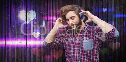 Composite image of hipster wearing headphones