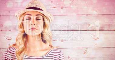 Composite image of gorgeous blonde hipster with straw hat