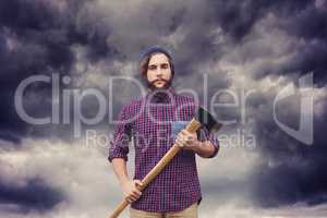 Composite image of portrait of hipster with axe