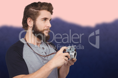 Composite image of hipster using digital camera