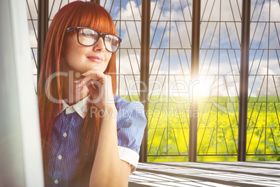 Composite image of attractive smiling hipster woman thinking