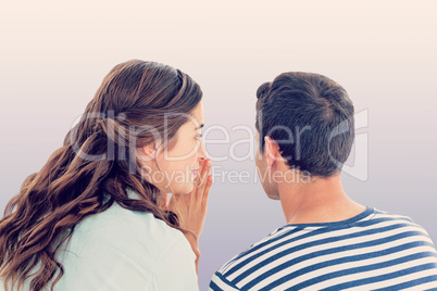 Composite image of woman whispering secret to boyfriend