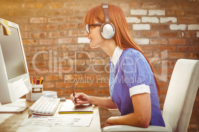 Composite image of attractive hipster woman with headset using g