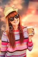 Composite image of attractive hipster woman holding a cup of cof