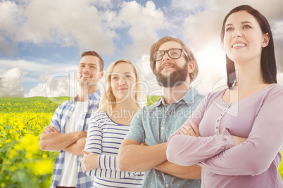 Composite image of smiling business people standing in row with