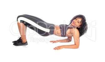 Pretty African American girl exercising.