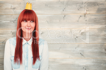 Composite image of happy hipster woman with a crowned