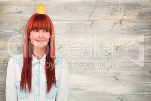 Composite image of happy hipster woman with a crowned