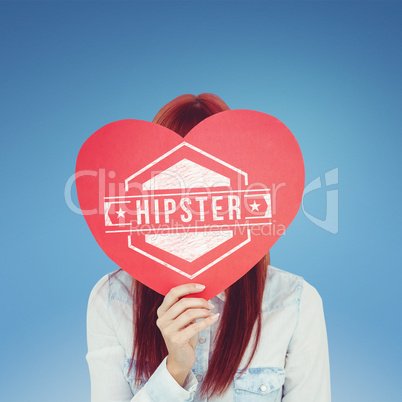 Composite image of attractive hipster woman behind a red heart