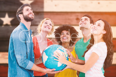 Composite image of young creative business people with a globe
