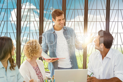 Composite image of group of young colleagues in a meeting