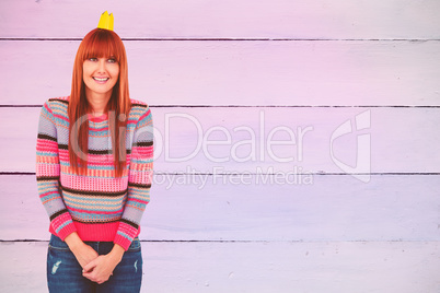 Composite image of portrait of a smiling hipster woman wearing h