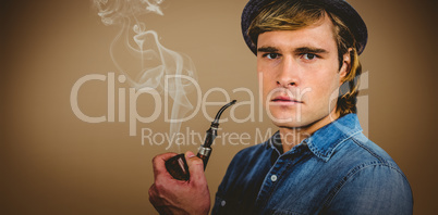 Composite image of serious hipster holding pipe