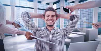 Composite image of smiling businessman being handed items