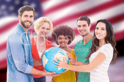 Composite image of young creative business people with a globe