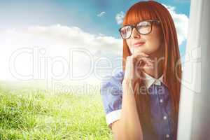 Composite image of attractive smiling hipster woman thinking