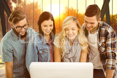 Composite image of smiling business people working at computer d