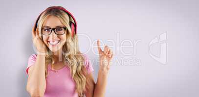 Composite image of portrait of a young hipster listening to musi