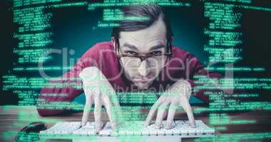 Composite image of man wearing eye glasses typing on computer ke