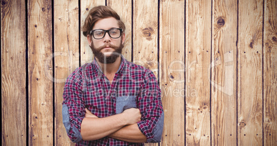 Composite image of confident hipster wearing eye glasses with ar
