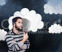Composite image of portrait of serious hipster smoking pipe