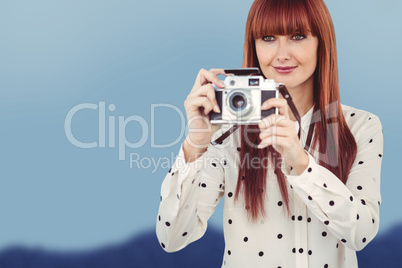 Composite image of attractive hipster woman using old fashioned