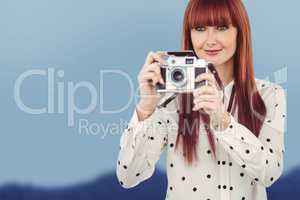 Composite image of attractive hipster woman using old fashioned