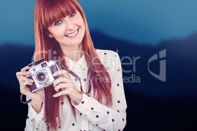 Composite image of attractive smiling hipster woman with old fas