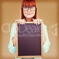 Composite image of smiling hipster woman holding blackboard