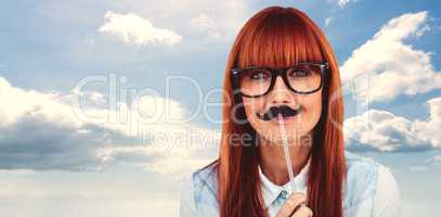 Composite image of portrait of a hipster woman with a mustache