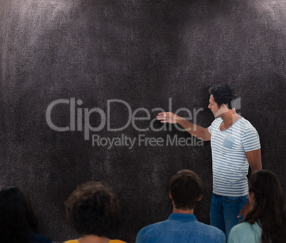 Composite image of casual businesswoman giving presentation to c