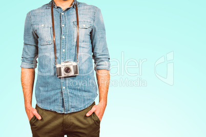 Composite image of hipster man holding digital camera