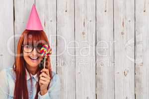 Composite image of pretty hipster woman with hat party and lolli