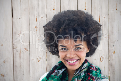 Composite image of brunette smiling to the camera