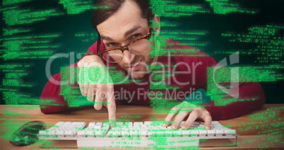 Composite image of man wearing eye glasses pointing on computer